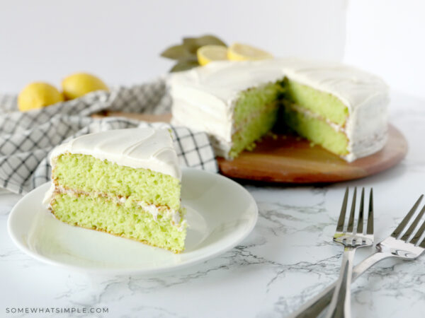 lime cake cut and served on a white plate