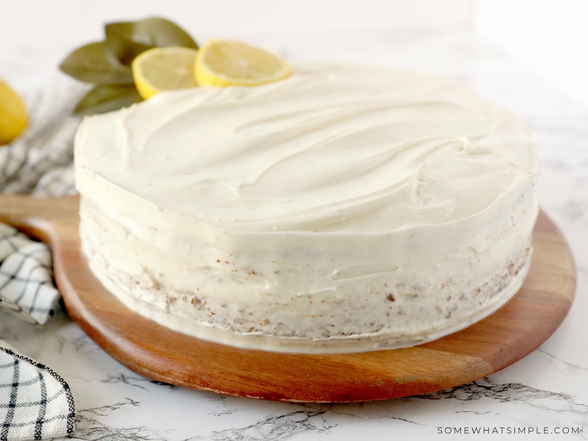 frosted lime cake on a brown serving platter