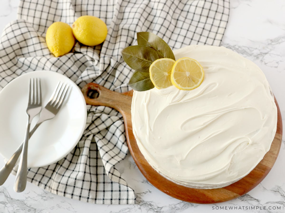 sliced lemon on top of a frosted cake