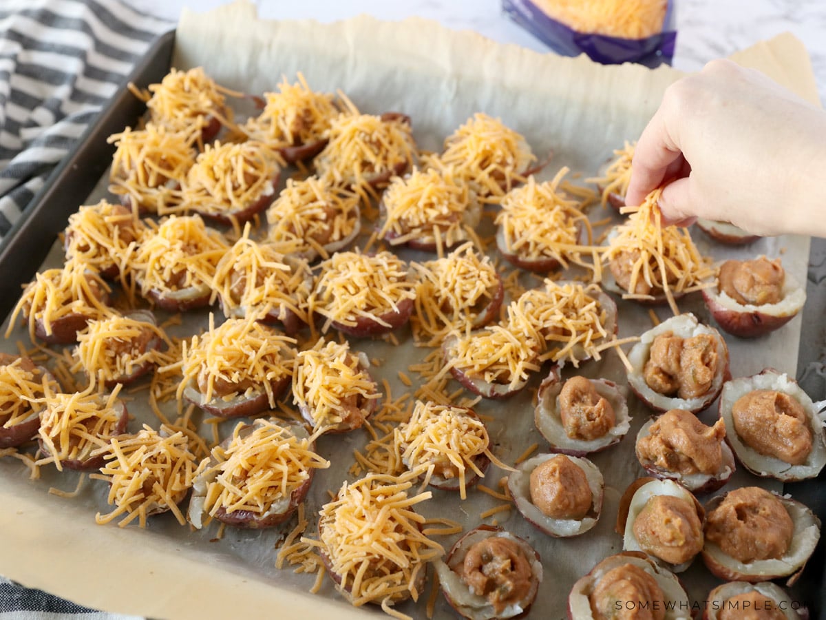 added shredder cheese and refried beans to empty potato skins