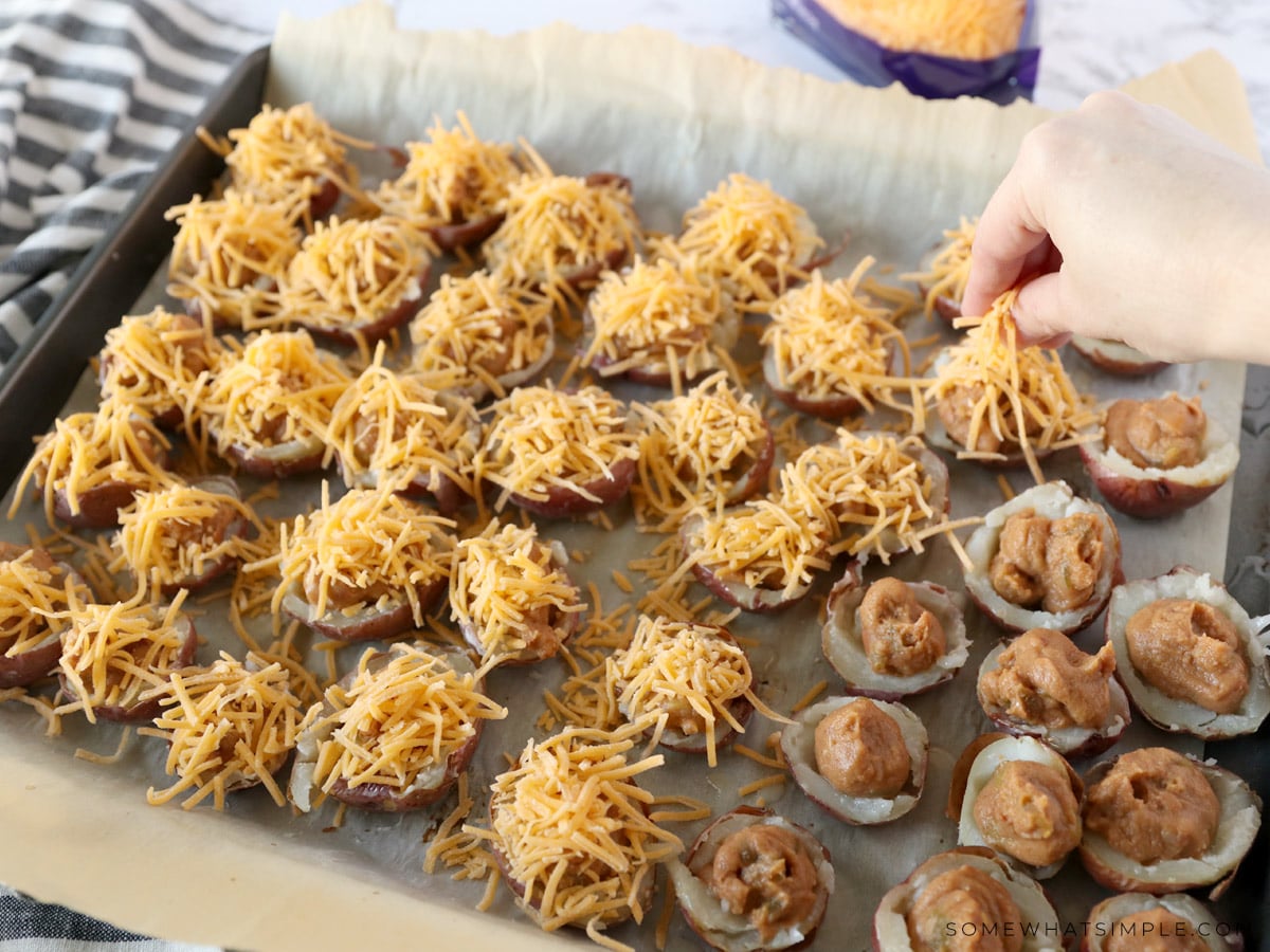 added shredder cheese and refried beans to empty potato skins