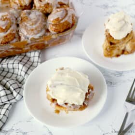 plated 30-minute cinnamon rolls with tray in background