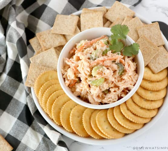 overhead shot of buffalo chicken salad on a platter with crackers