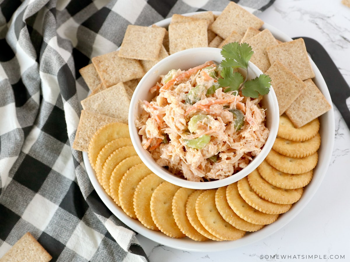 overhead shot of buffalo chicken salad on a platter with crackers