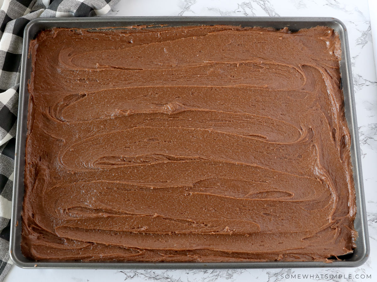 spreading brownie batter in a pan