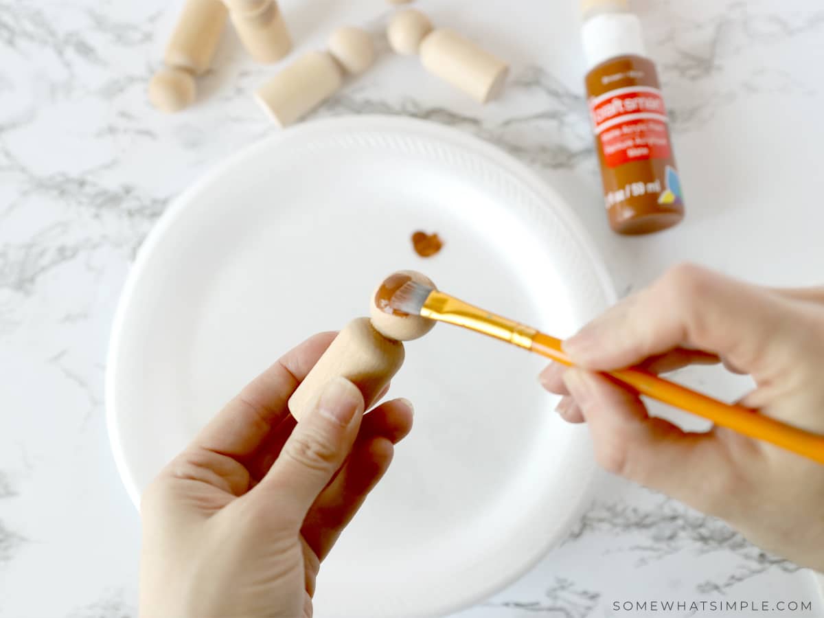 painting wooden spool dolls