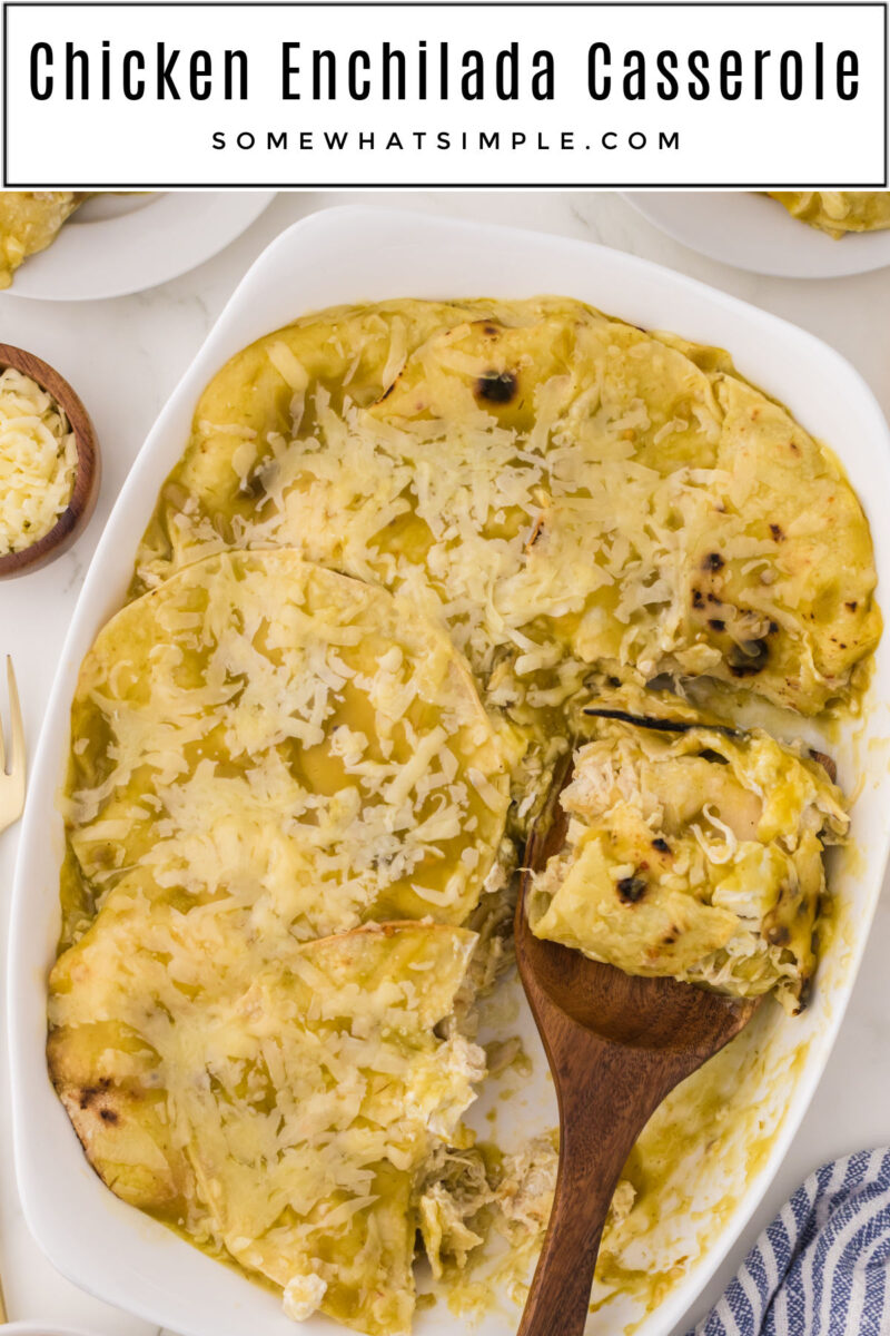 long image of green chili chicken enchilada casserole with wooden serving spoon