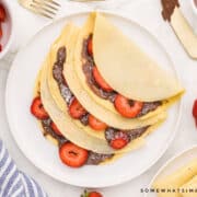 plated crepes with strawberries and nutella