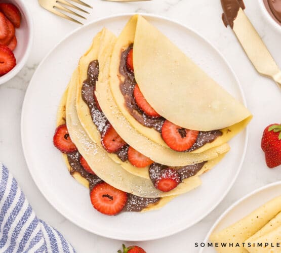 plated crepes with strawberries and nutella