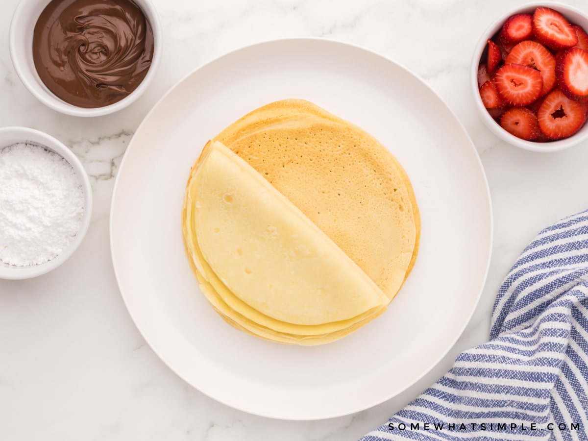 finished stack of crepes on a white plate