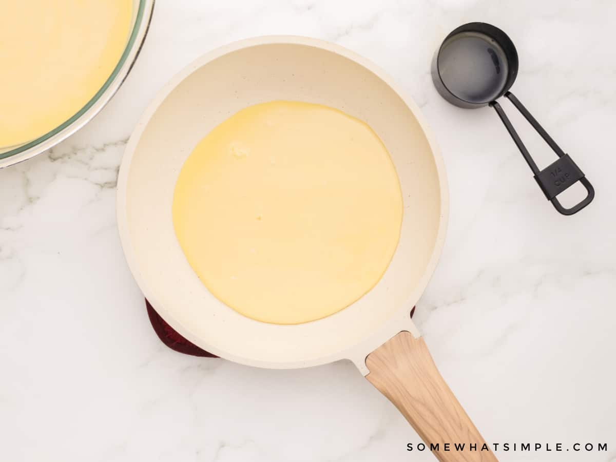 cooking a crepe in a skillet