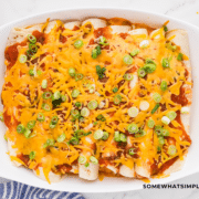 finished product of 3 Cheese Enchiladas in a white dish