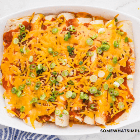finished product of 3 Cheese Enchiladas in a white dish
