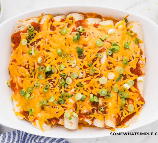 finished product of 3 Cheese Enchiladas in a white dish
