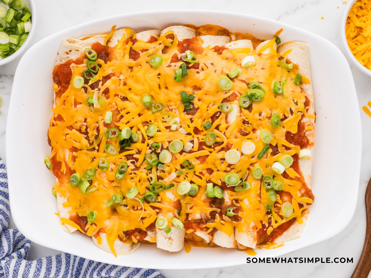 finished product of 3 Cheese Enchiladas in a white dish
