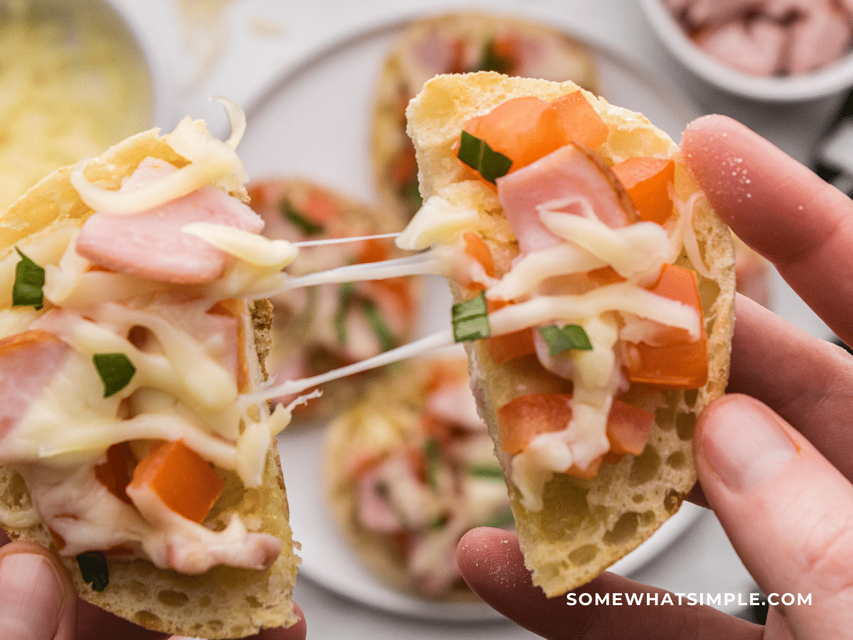 finishes product of Bruschetta breakfast on white plate being pulled in half