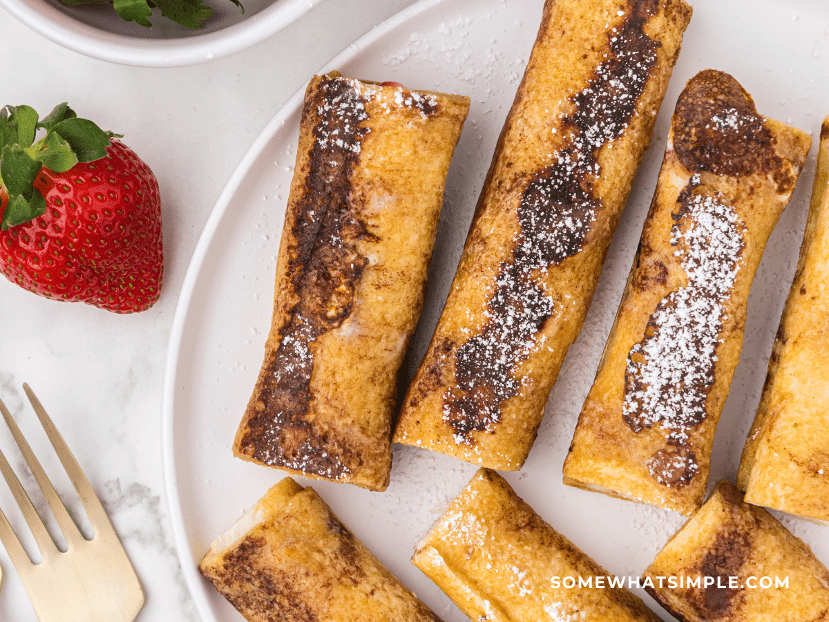 photo of French toast rollups on a white plate