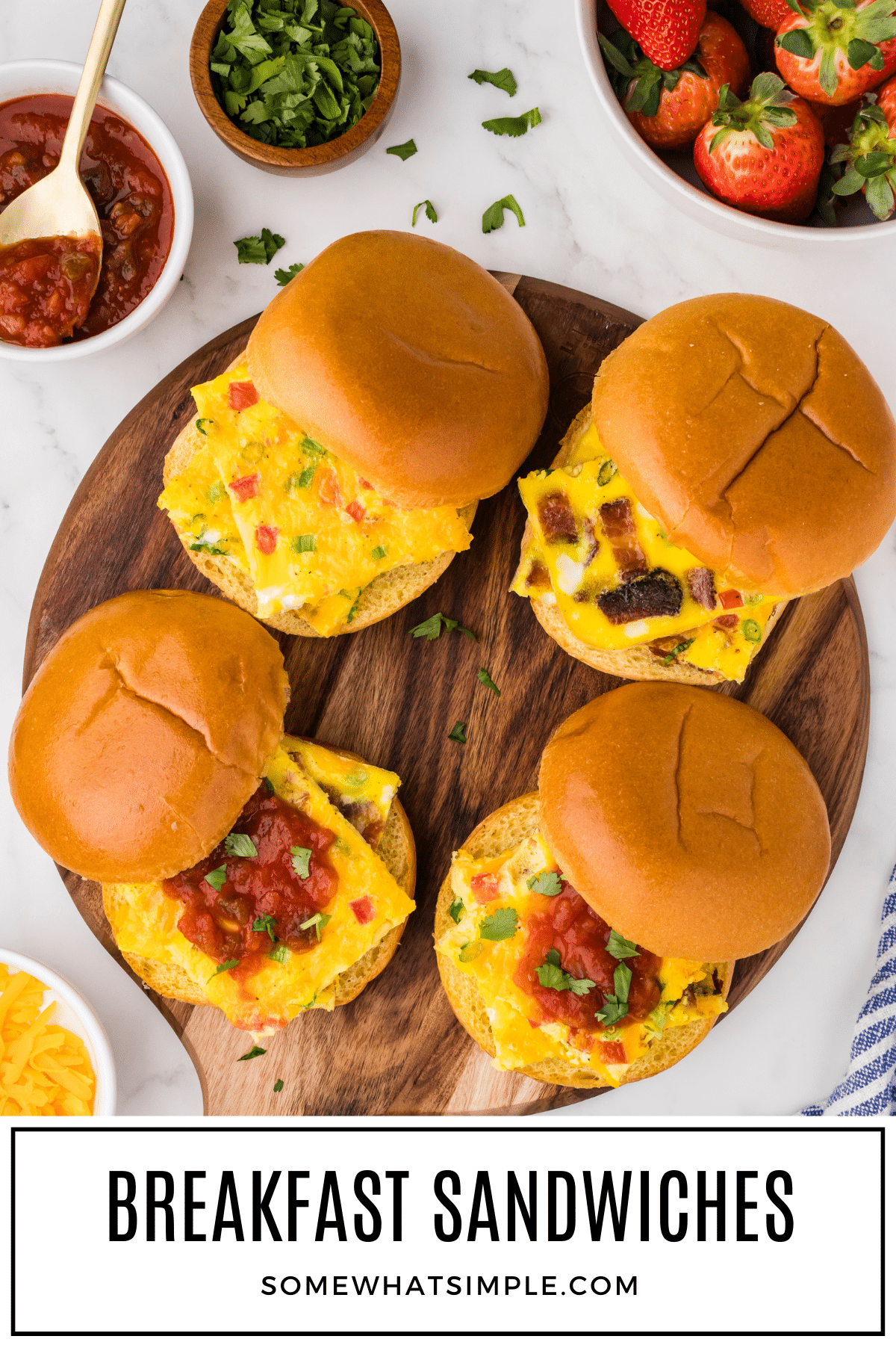 Baked sheet pan breakfast sandwiches are a simple and delicious meal that's perfect for feeding a crowd or meal prepping for the week! via @somewhatsimple