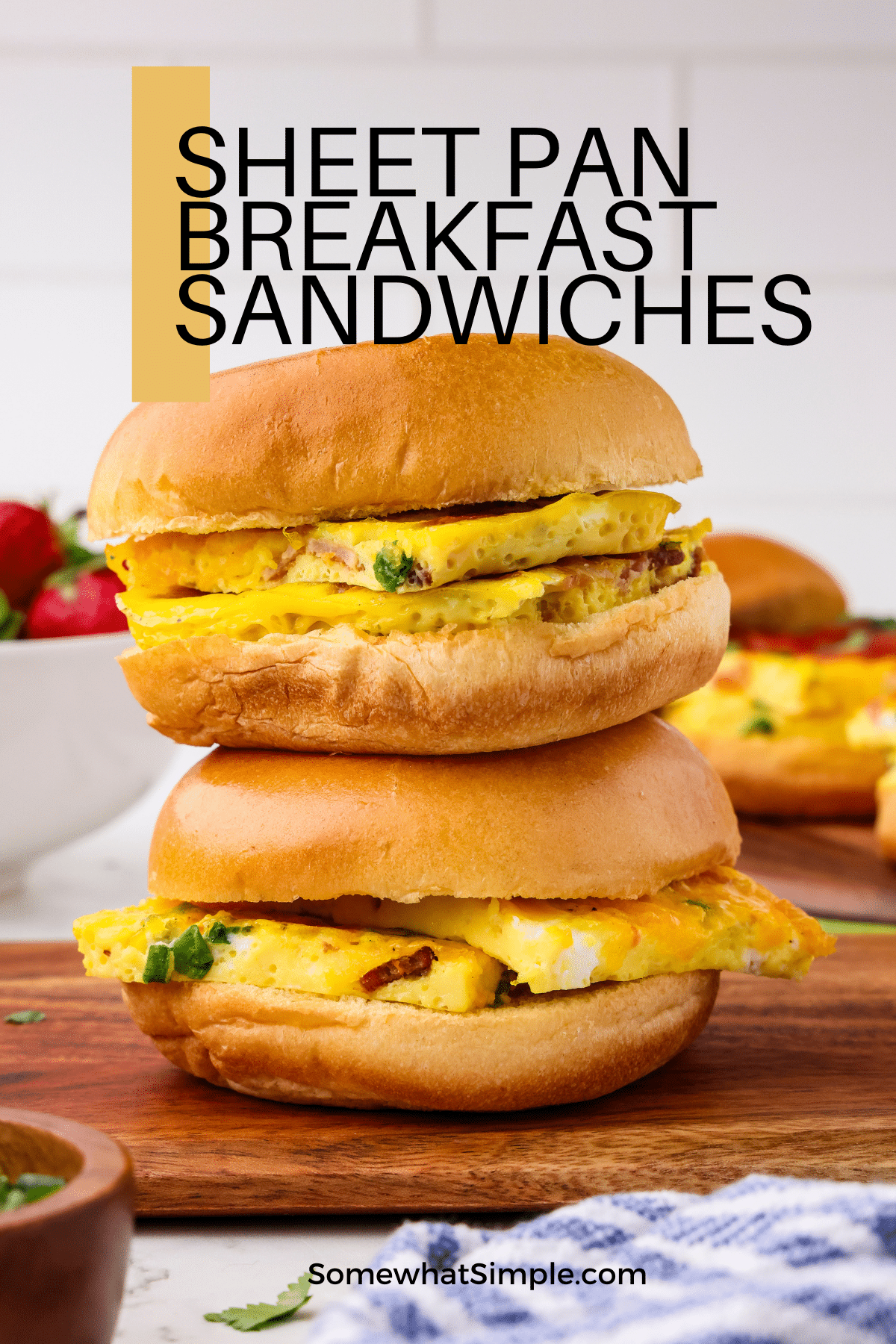 Baked sheet pan breakfast sandwiches are a simple and delicious meal that's perfect for feeding a crowd or meal prepping for the week! via @somewhatsimple