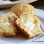 honey muffin rolls cut in half with butter spread on them