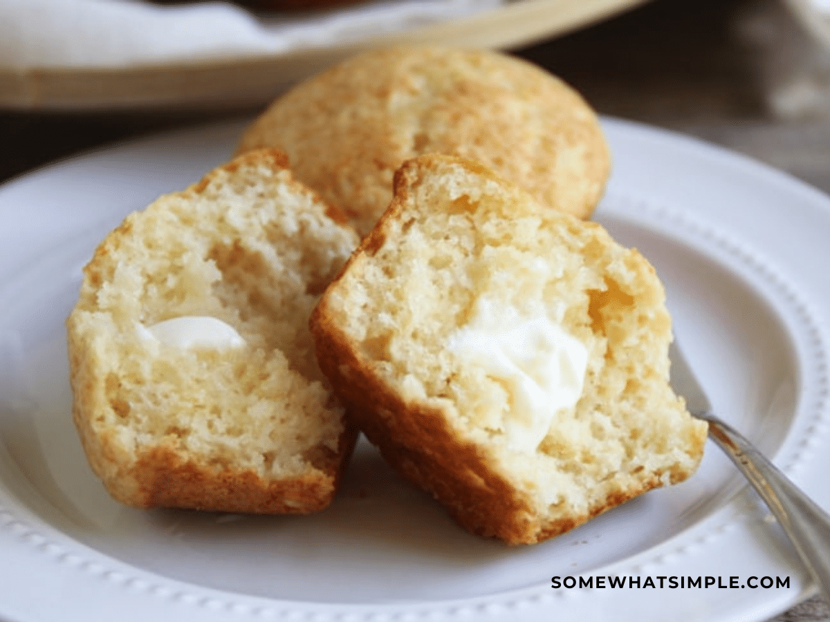 honey muffin rolls cut in half with butter spread on them