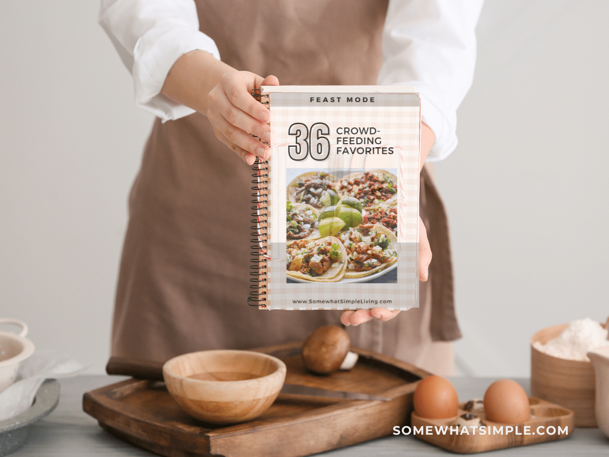 Woman holding a recipe book in the kitchen