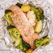 herb butter salmon foil dinner, plated in foil.