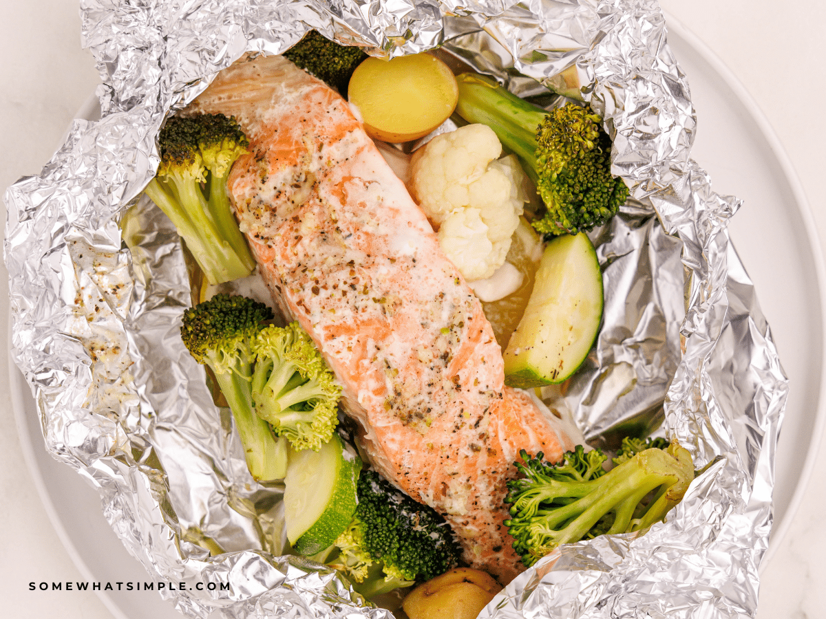 herb butter salmon foil dinner, plated in foil.