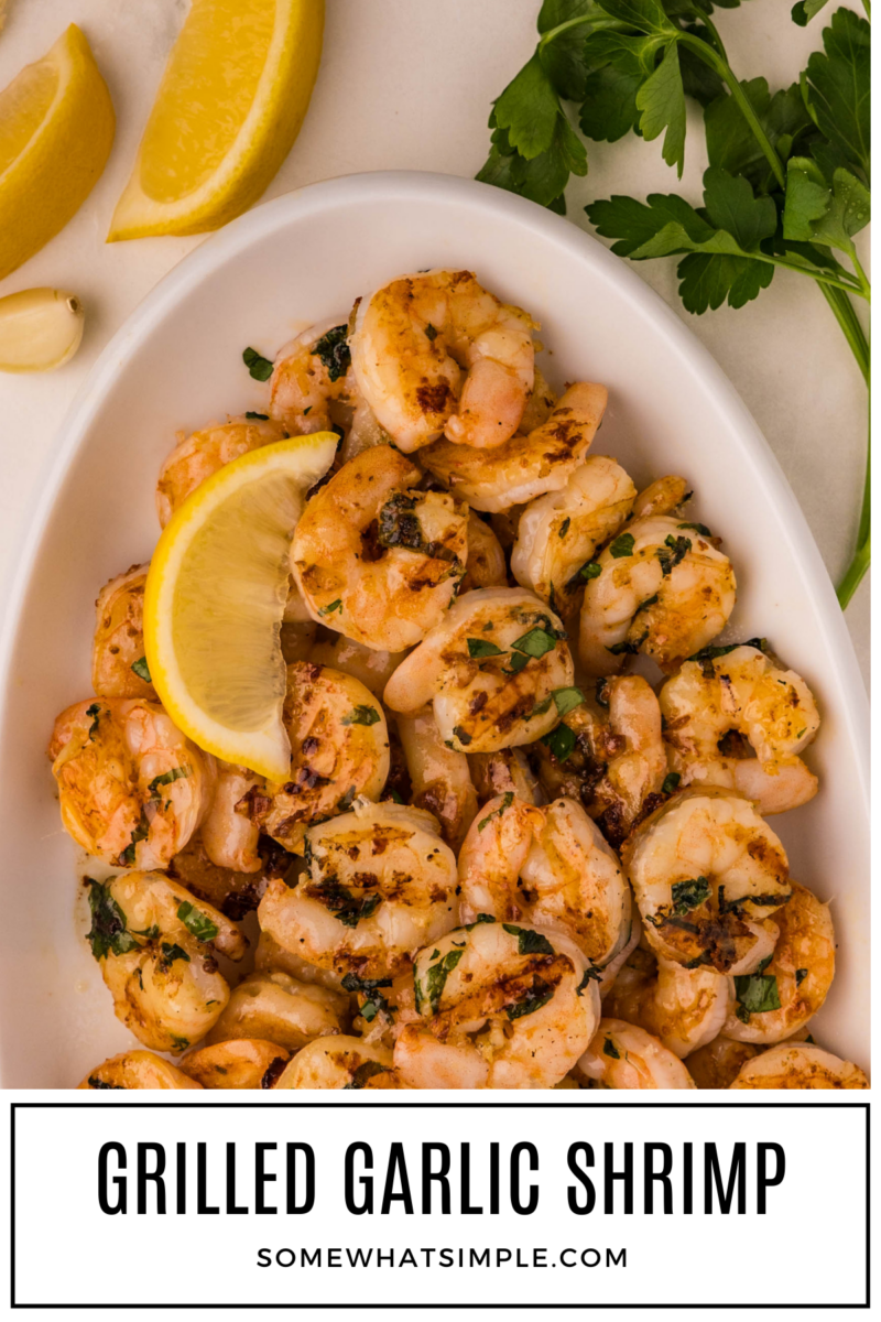 lemon wedge on a plate of Grilled Garlic Shrimp