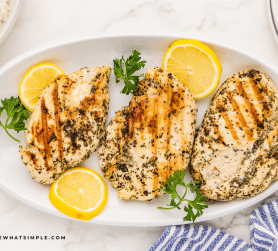 plated marinated italian chicken breasts shot overhead