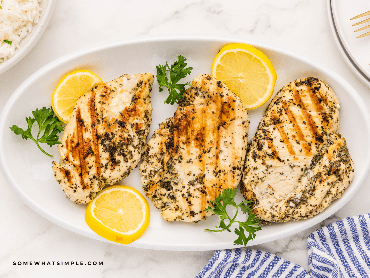 plated marinated italian chicken breasts shot overhead