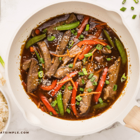 Teriyaki Beef Stir Fry in a white serivign bowl