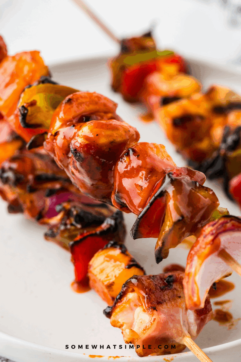 showing off the sauce for Hawaiian Bacon-Wrapped Chicken Kabobs