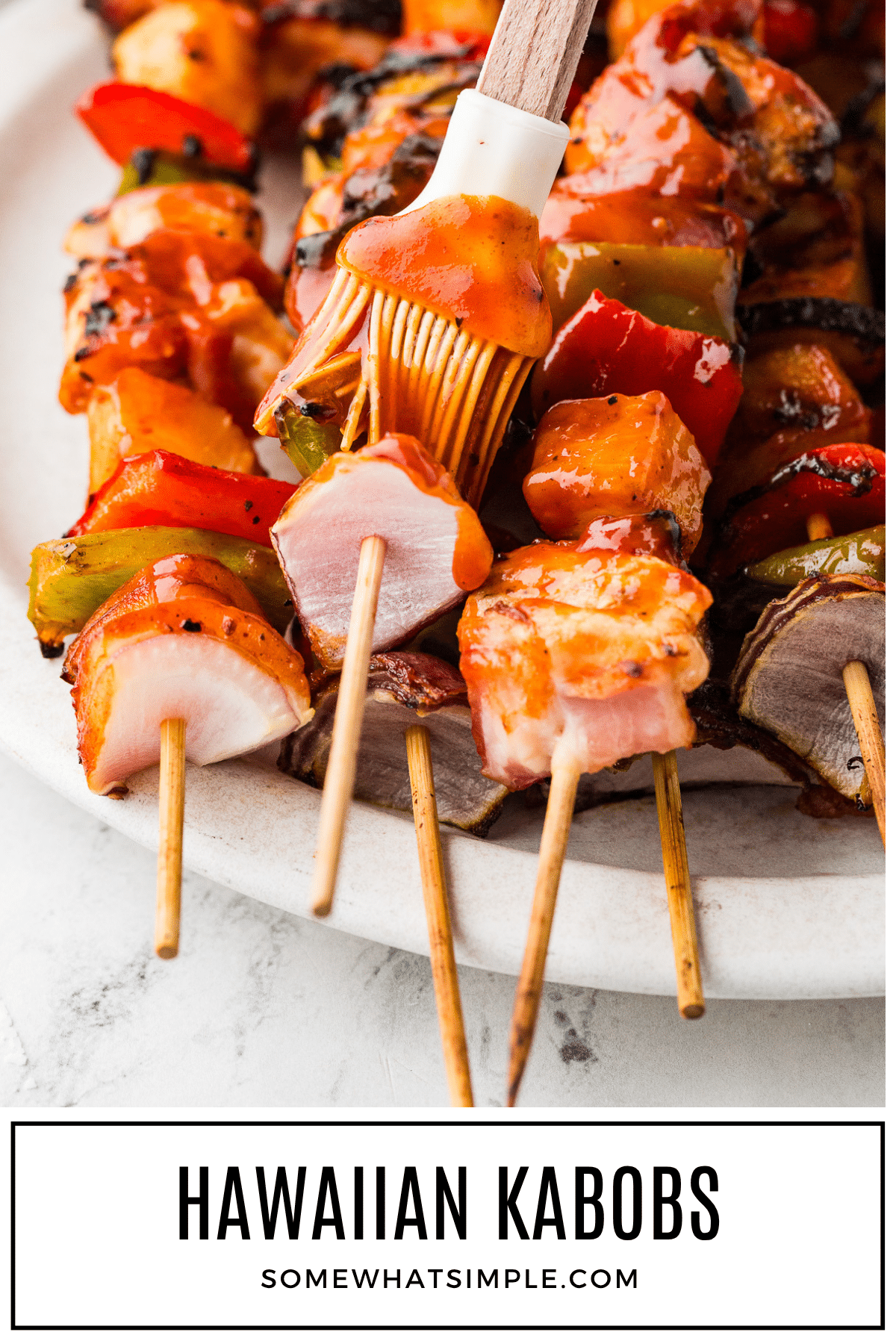 These Hawaiian Bacon-Wrapped Chicken Kabobs are the perfect sweet and savory summer meal. Juicy chicken, crispy bacon, and grilled pineapple – all in one bite! via @somewhatsimple