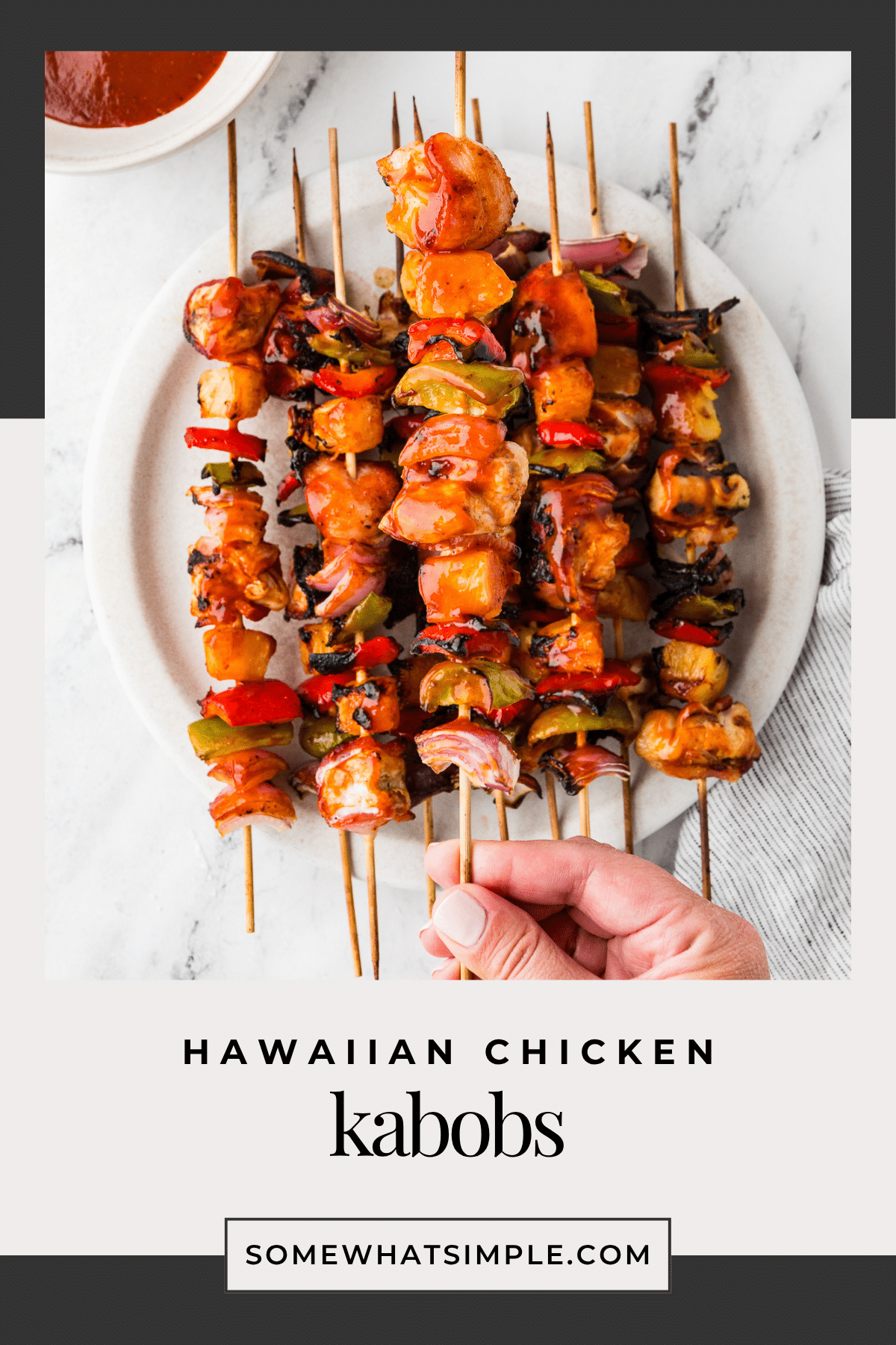 These Hawaiian Bacon-Wrapped Chicken Kabobs are the perfect sweet and savory summer meal. Juicy chicken, crispy bacon, and grilled pineapple – all in one bite! via @somewhatsimple