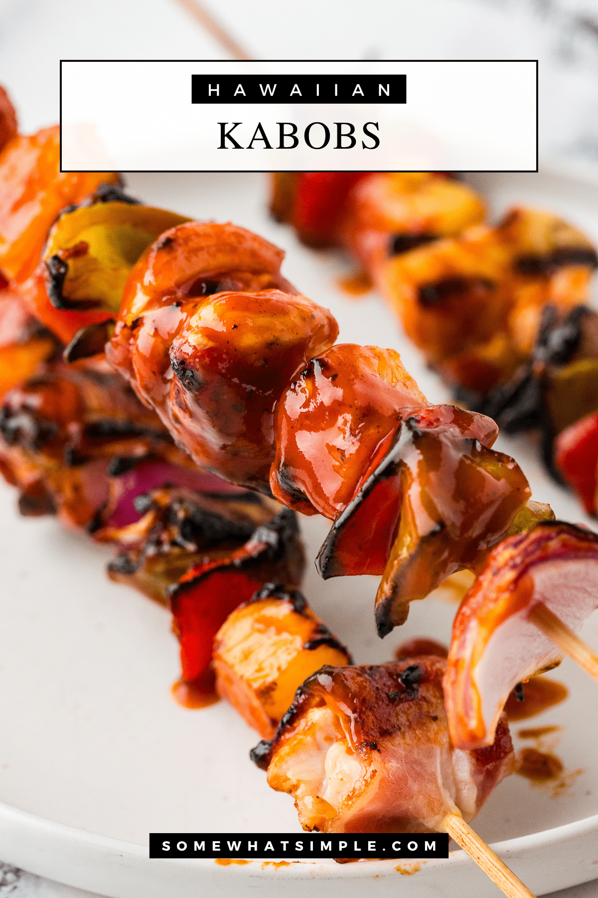 These Hawaiian Bacon-Wrapped Chicken Kabobs are the perfect sweet and savory summer meal. Juicy chicken, crispy bacon, and grilled pineapple – all in one bite! via @somewhatsimple