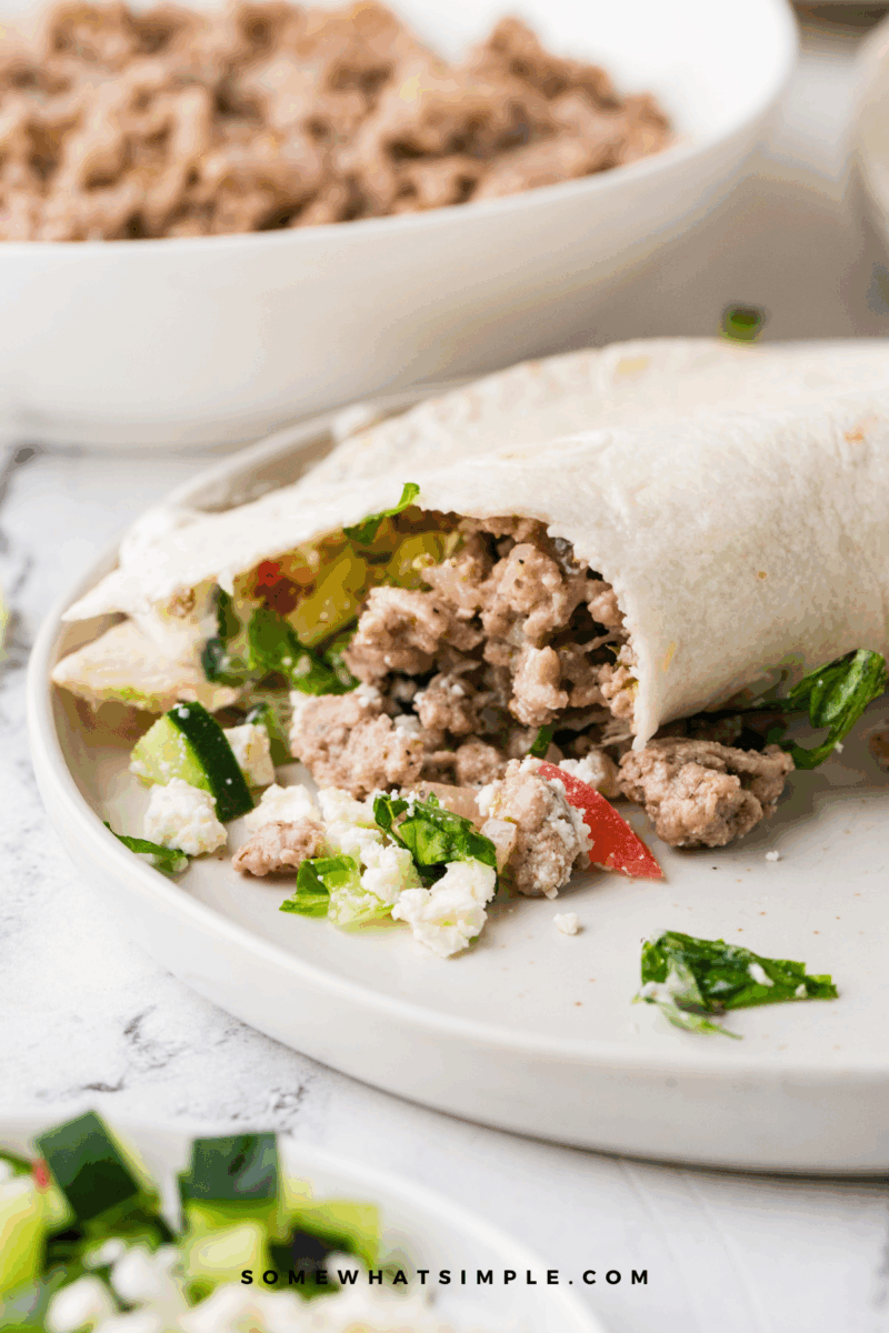 plated Gyro Taco with ingredients in the background