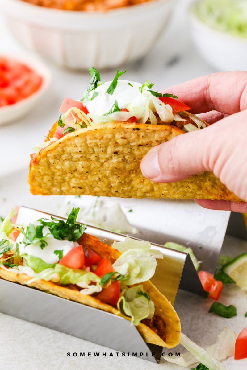 hand holding a Rotisserie Chicken Taco