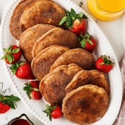 plated churro pancakes with strawberries
