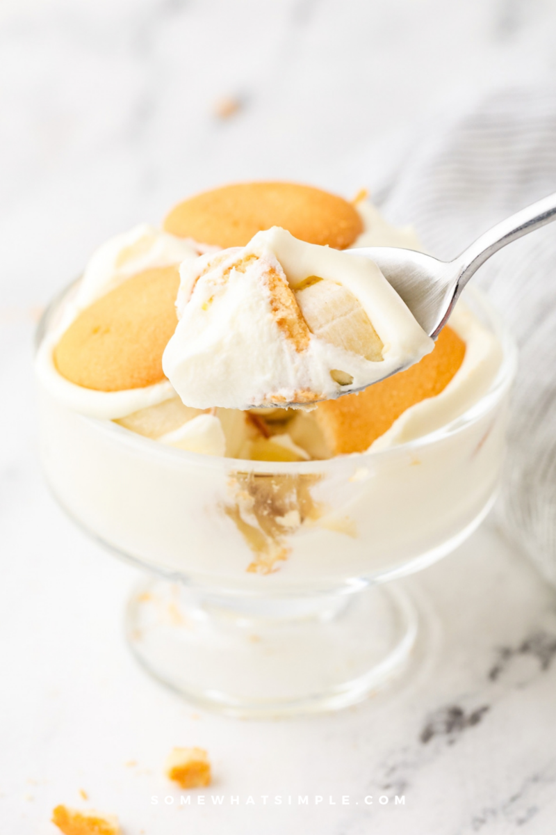 spoon digging into a dessert glass with Banana Pudding in it